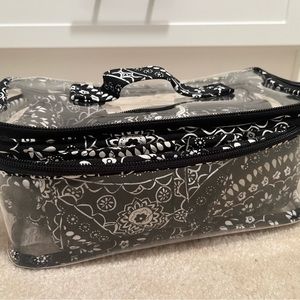 Vera Bradley 4 piece travel cosmetics bag.
